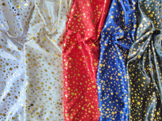 Stoff "Sterne", Satin-Polyester, B 150cm, versch. Farben